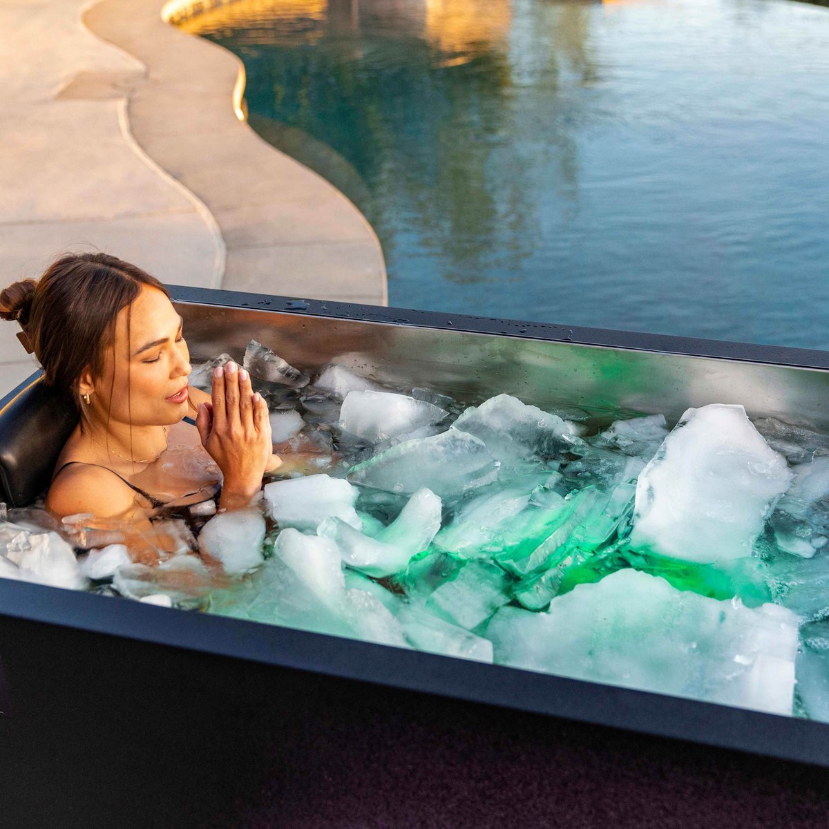 Woman meditating in a Sun Home Cold Plunge Pro ice bath at a spa